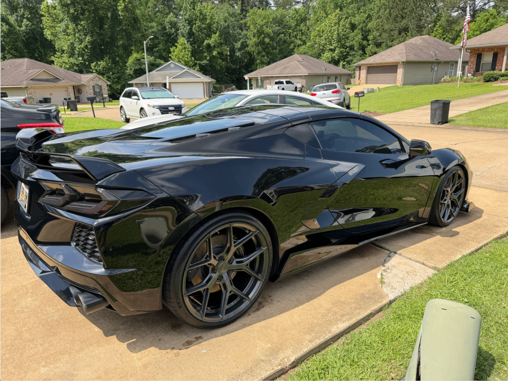 Glossy black sports car with deep reflections